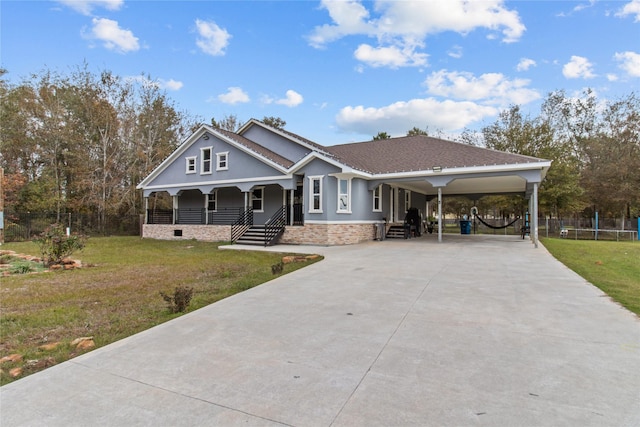 view of front of home featuring a carport, a porch, and a front yard