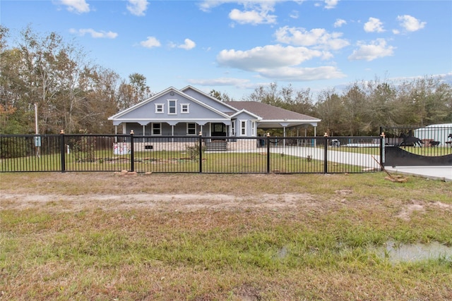 view of front of home with a front lawn and a carport