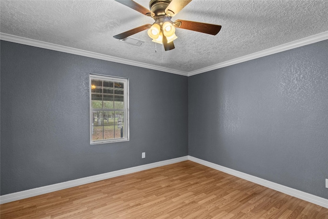 empty room with a textured ceiling, light hardwood / wood-style flooring, ceiling fan, and ornamental molding