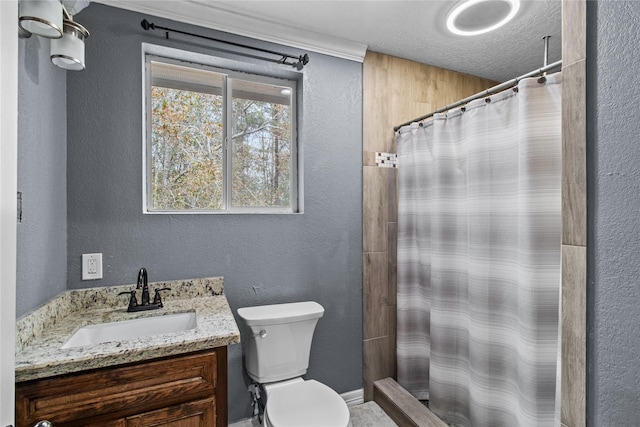 bathroom featuring vanity, a shower with shower curtain, a textured ceiling, and toilet