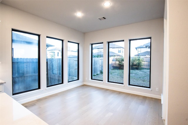 spare room featuring light wood-type flooring