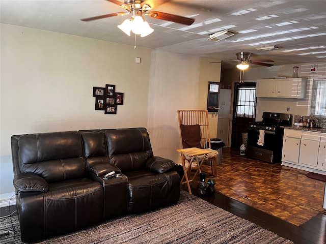 living room featuring dark parquet floors