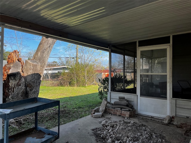 view of patio / terrace featuring a sunroom