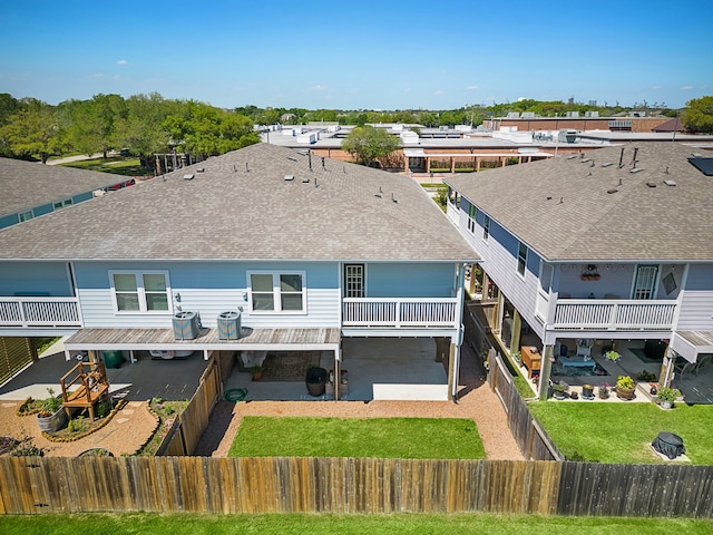 back of property with a patio