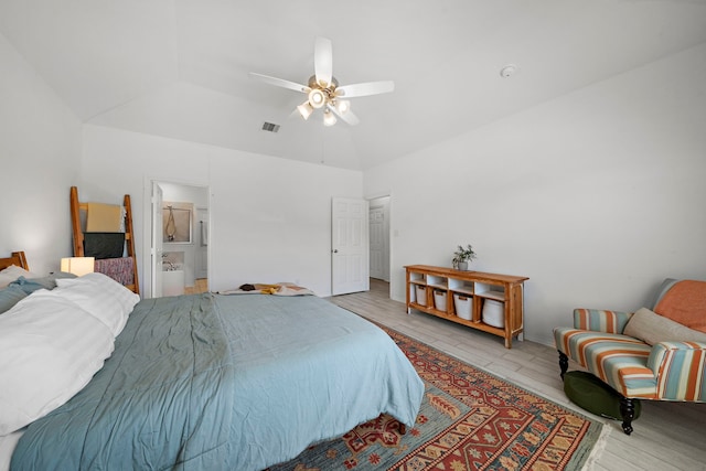 bedroom featuring ensuite bathroom, vaulted ceiling, and ceiling fan