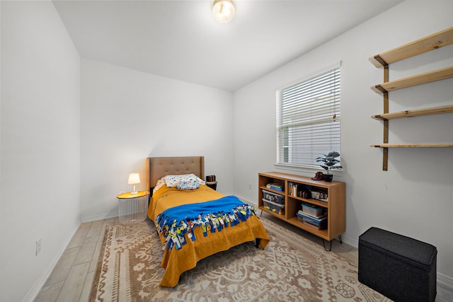 bedroom with light wood-type flooring