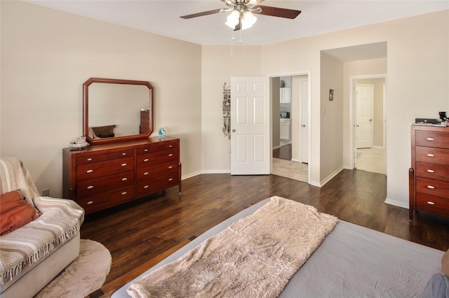 bedroom featuring dark hardwood / wood-style floors, ceiling fan, and ensuite bathroom