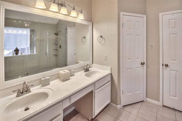 bathroom featuring vanity, tile patterned floors, and a shower with shower door