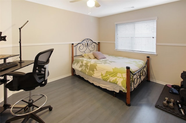 bedroom featuring ceiling fan and dark hardwood / wood-style floors