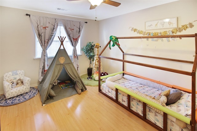 bedroom featuring ceiling fan and wood-type flooring