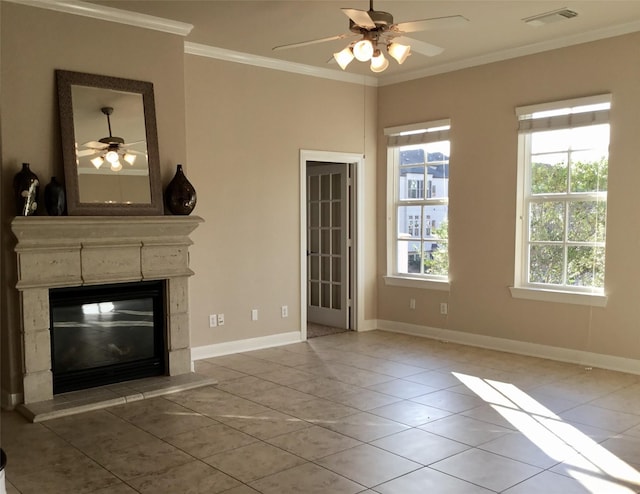 unfurnished living room featuring ceiling fan, tile patterned floors, and crown molding