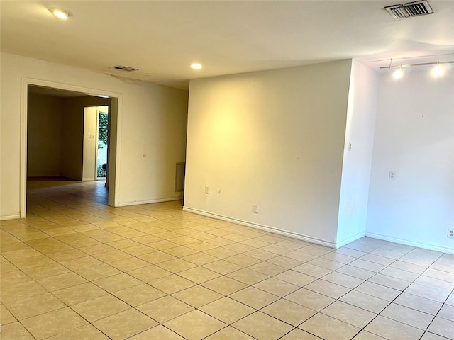 empty room with light tile patterned floors