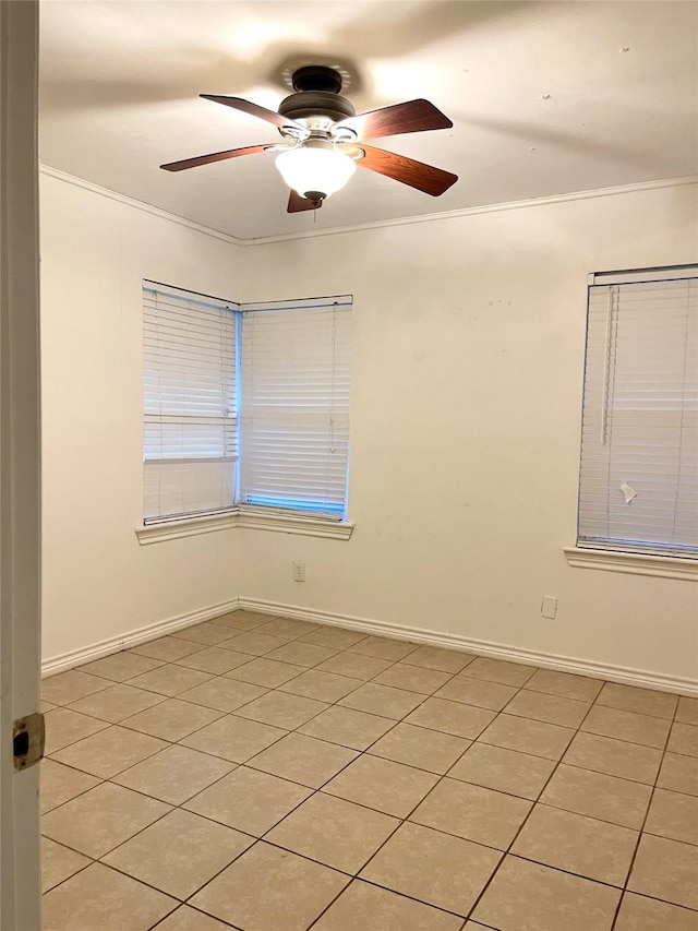 empty room with light tile patterned floors, ceiling fan, and crown molding