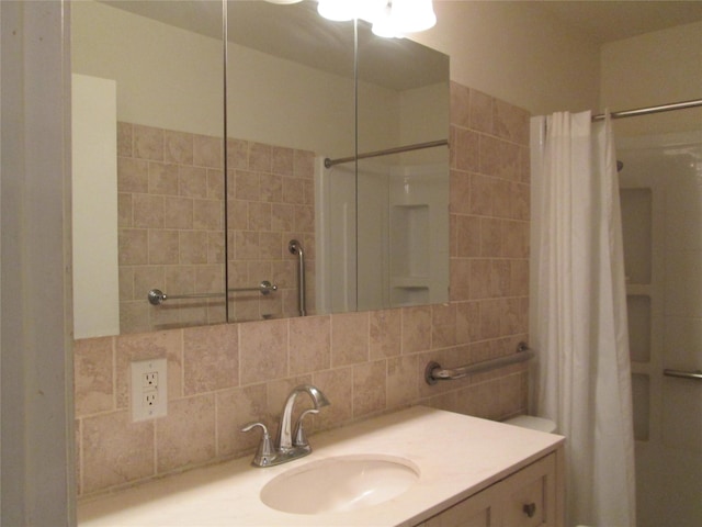 bathroom featuring a shower with shower curtain, vanity, and tasteful backsplash