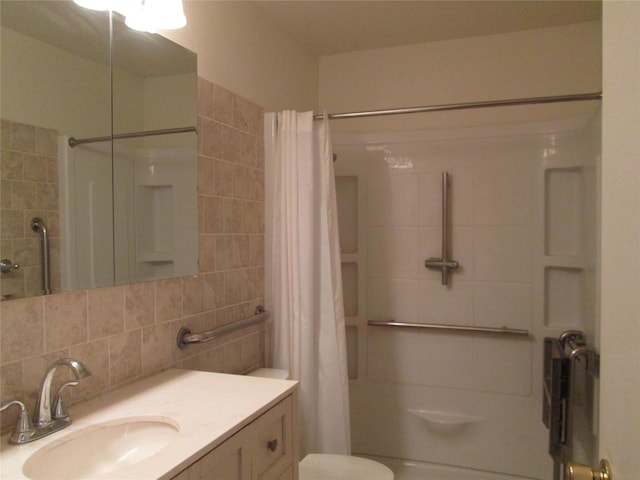 bathroom with backsplash, toilet, vanity, and walk in shower