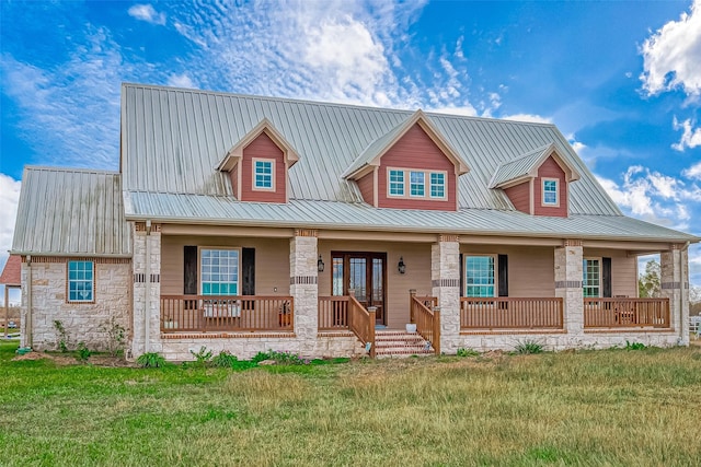 view of front of property featuring covered porch and a front yard