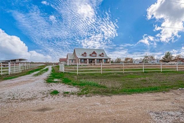 view of front of property featuring a rural view