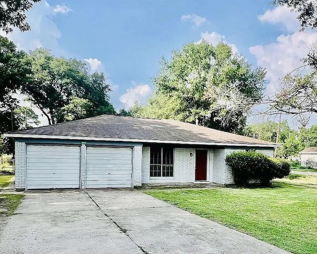 ranch-style home with a front lawn and a garage