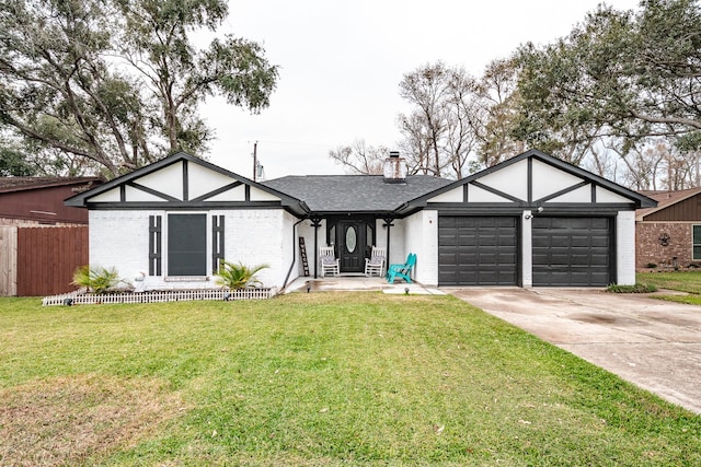 view of front of house with a front yard and a garage