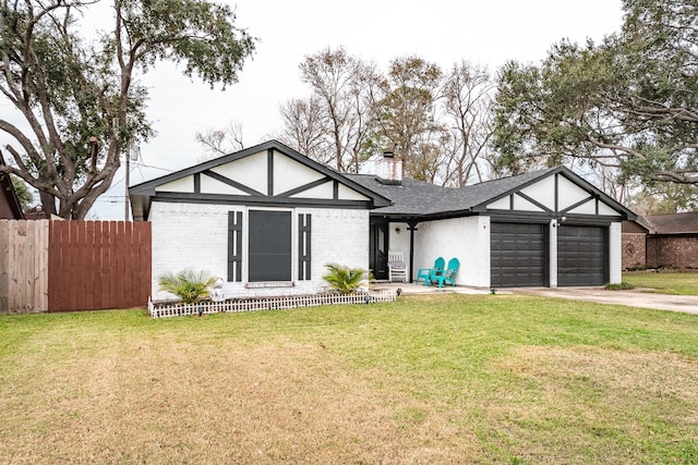 view of front facade with a garage and a front lawn