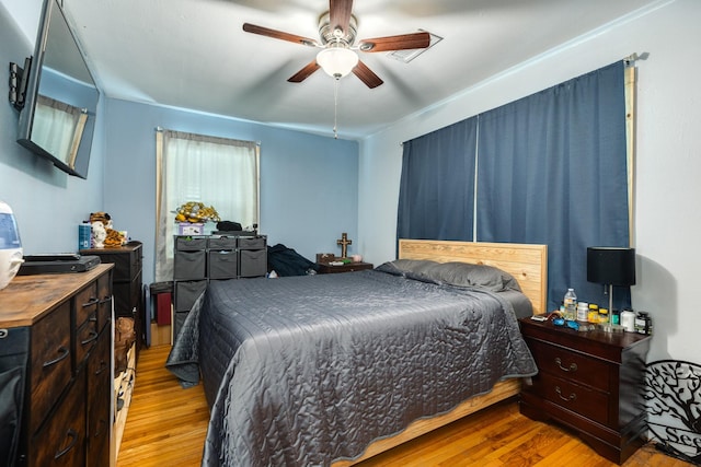 bedroom featuring light hardwood / wood-style flooring and ceiling fan