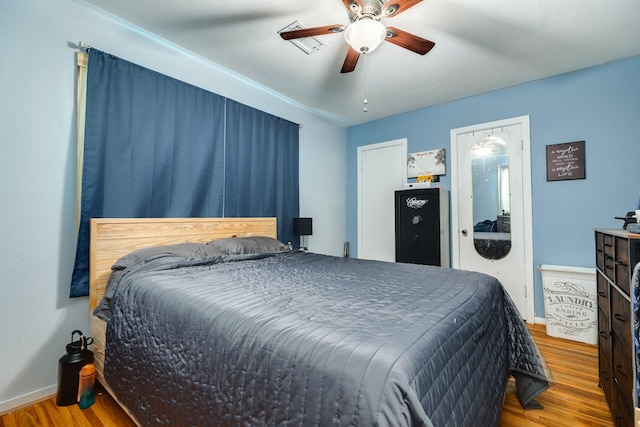 bedroom featuring ceiling fan and light wood-type flooring