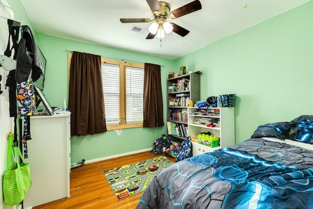 bedroom featuring ceiling fan and light wood-type flooring