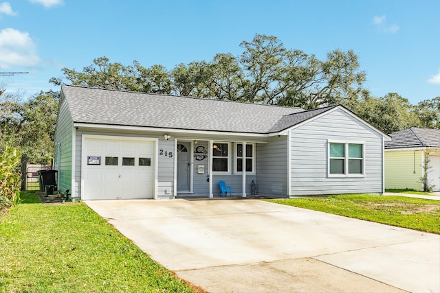 single story home with a front yard and a garage