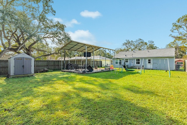 view of yard with a patio area and a shed