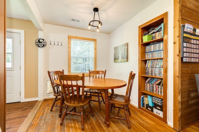 dining room with hardwood / wood-style flooring