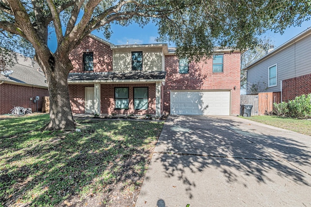 townhome / multi-family property with a garage and a front yard