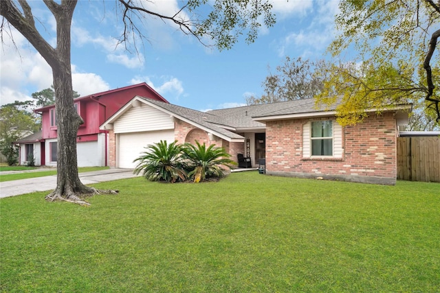 ranch-style home with a garage and a front lawn