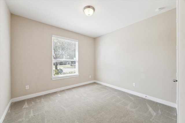 empty room with light colored carpet