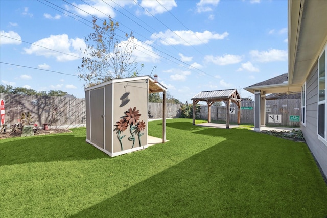 view of yard with a gazebo and a shed