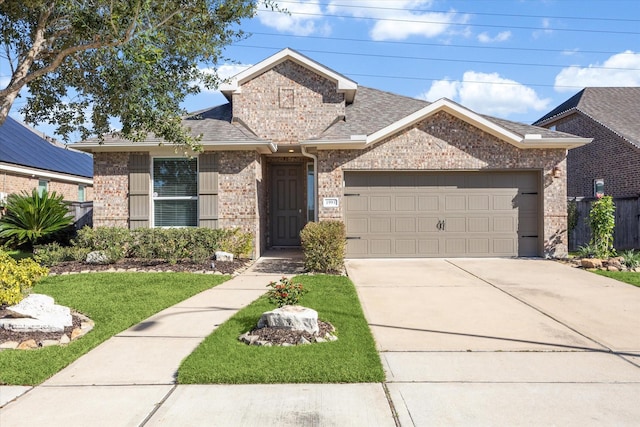 view of front of property featuring a garage