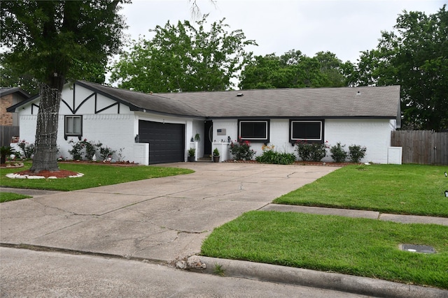 view of front facade with a garage and a front yard