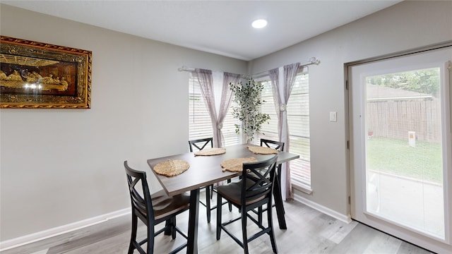 dining area with light hardwood / wood-style flooring