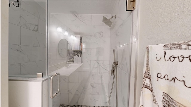 bathroom with a shower with shower door