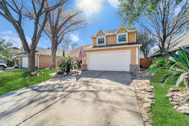 view of front of house with a garage and a front lawn