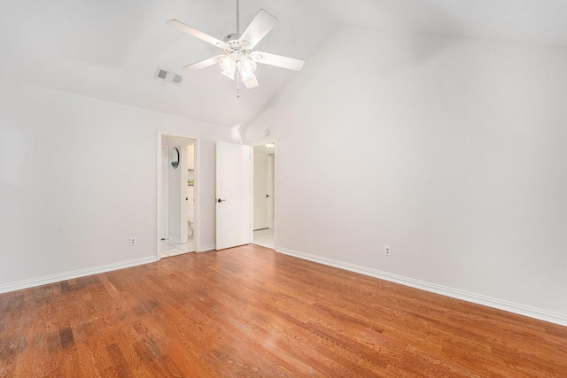 empty room featuring wood-type flooring, ceiling fan, and high vaulted ceiling