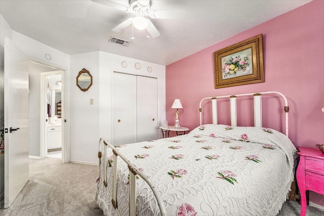 carpeted bedroom with a closet and ceiling fan