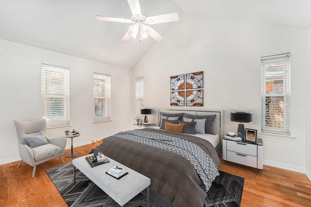 bedroom featuring lofted ceiling, hardwood / wood-style floors, and ceiling fan