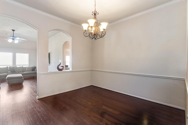 unfurnished room with dark hardwood / wood-style floors, crown molding, and ceiling fan with notable chandelier