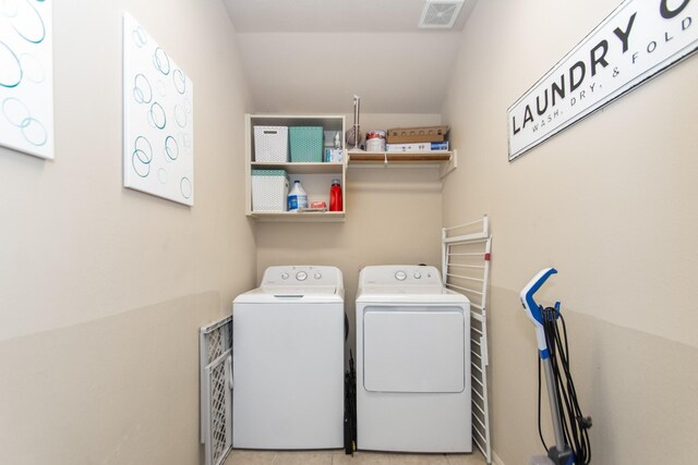 laundry room with washer and clothes dryer