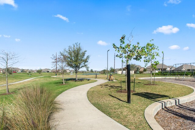 view of community featuring a yard