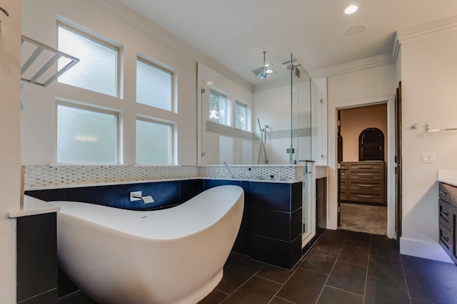 bathroom featuring tile patterned flooring, vanity, independent shower and bath, and ornamental molding