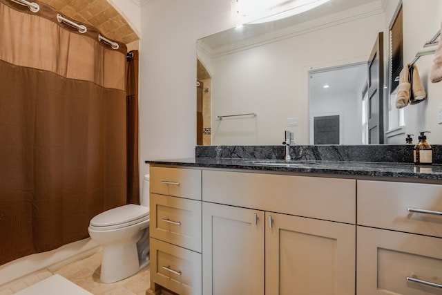 bathroom with tile patterned flooring, vanity, toilet, and crown molding