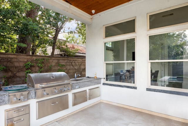 view of patio / terrace with sink, a grill, and exterior kitchen