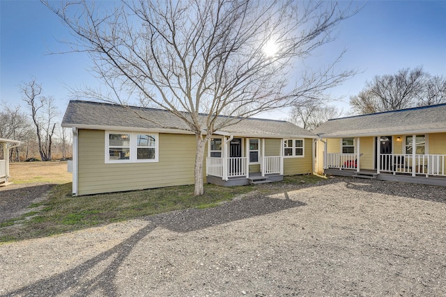 single story home featuring covered porch