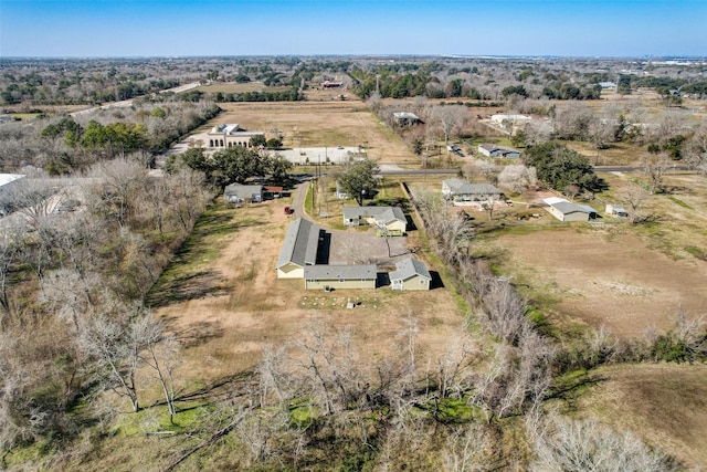 birds eye view of property with a rural view